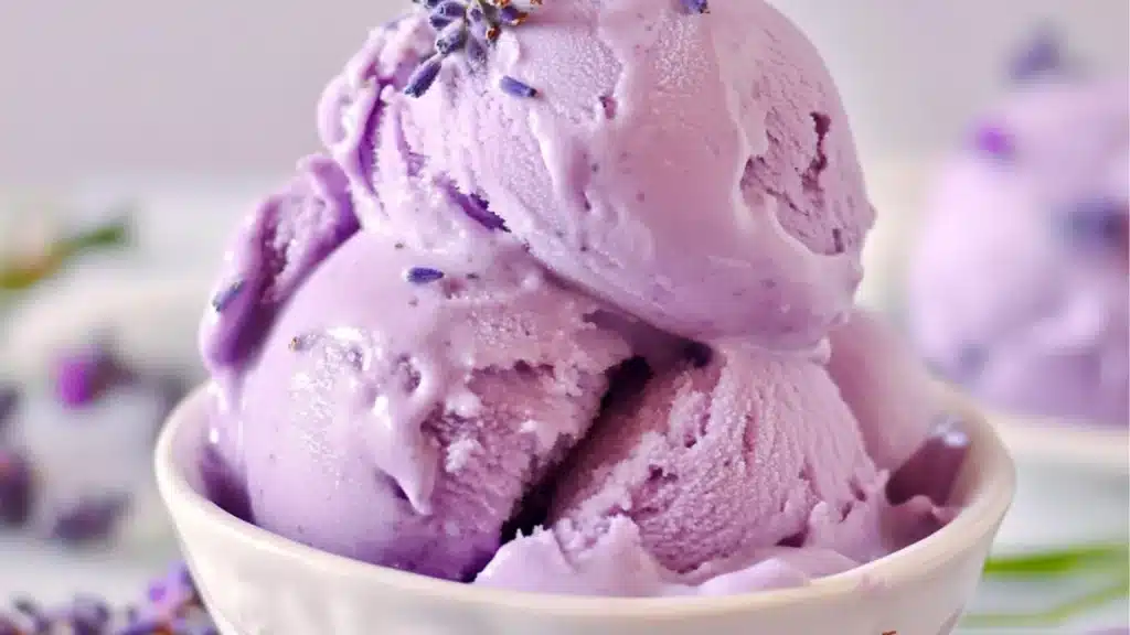 lavender ice cream in a white bowl