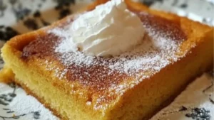 pumpkin spice magic custard cake is cut into squares and put on a plate