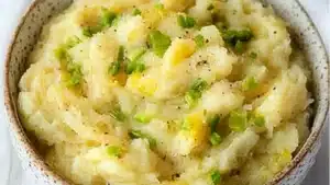 collage of irish potatoes and cabbage with text overlay that reads collage of colamon, irish potatoes and cabbage